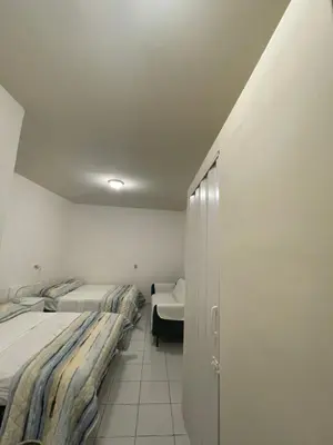 a room with two beds and a closet in it at Two Beds San Francisco Chinameca in San Francisco Chinameca