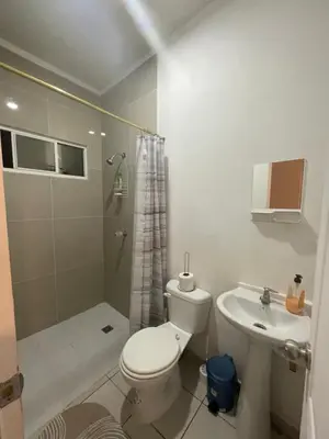 a bathroom with a toilet and a shower and a sink at Two Beds San Francisco Chinameca in San Francisco Chinameca