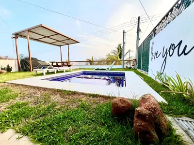 a swimming pool in the yard of a house at Luxury Apartment- View- Pool- La Libertad Surfcity in La Libertad