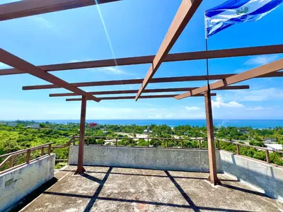a view from the balcony of a house with a flag at Luxury Apartment- View- Pool- La Libertad Surfcity in La Libertad