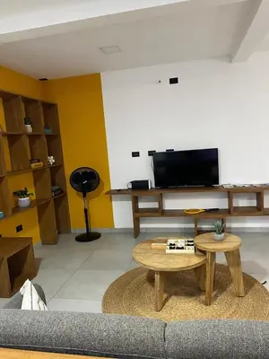a living room with a couch and a table at via costera 1 in La Libertad