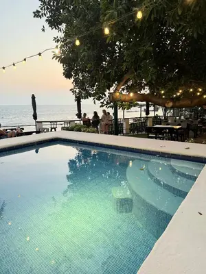 a swimming pool with a view of the ocean at Hotel Casa Miramar in Tamanique