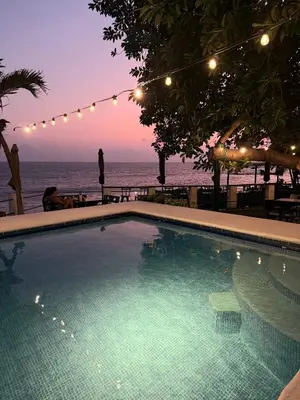 a swimming pool with a view of the ocean at Hotel Casa Miramar in Tamanique