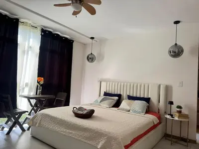 a bedroom with a bed with a bowl on it at Dormitorio privado con tu propio baño El apartamento la cocina y las áreas comunes son compartidas in San Salvador