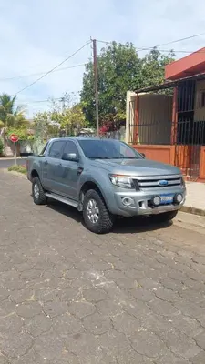 a silver truck parked in front of a building at Casa San Fernando, Ahuachapan in Ahuachapán