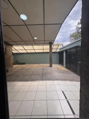 an empty building with a large open ceiling at Mochila Urban1 in San Salvador