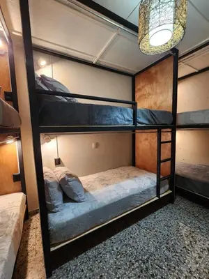 a bunk bed room with two bunk beds in it at Mochila Urban1 in San Salvador