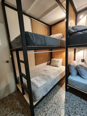 a group of bunk beds in a room at La Mochila Urbana1 in San Salvador