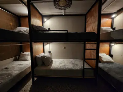 a group of bunk beds in a room at La Mochila Urbana1 in San Salvador