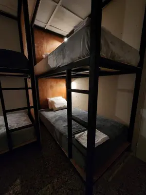 a couple of bunk beds in a room at La Mochila Urbana4 in San Salvador