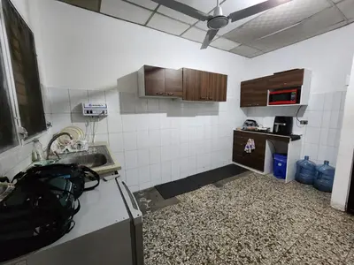 a kitchen with a sink and a counter top at La Mochila Urbana4 in San Salvador