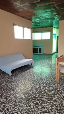 a bedroom with a bed in a room with green ceilings at San Fernando, Ahuachapan in Ahuachapán