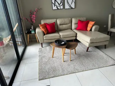 a living room with a couch and a table at Luxury Apartment -The Flats in San Salvador