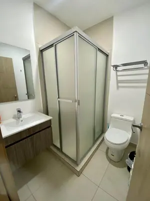 a bathroom with a shower and a toilet and a sink at Luxury Apartment -The Flats in San Salvador