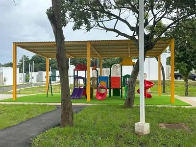 a playground in a park with a pavilion at Maadi-Tiny House-Los Ausoles in Ahuachapán