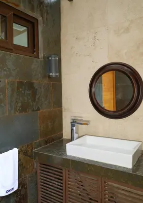 a bathroom with a sink and a mirror at Then open space allowed for us to enjoy a big gathering in El Zapote