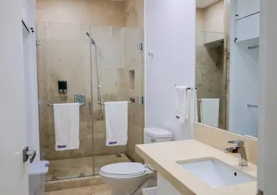 a bathroom with a shower and a toilet and a sink at Then open space allowed for us to enjoy a big gathering in El Zapote