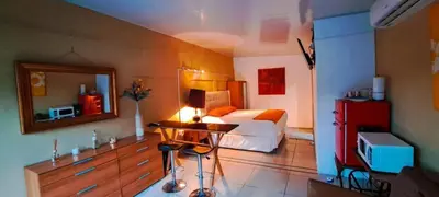 a bedroom with a bed and a table with a lamp at Suite 607 Ciudad jardín San Miguel A in San Miguel