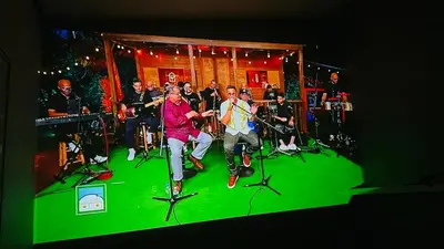 a group of people in a band on a stage at Cerca de todo en La Union in La Unión