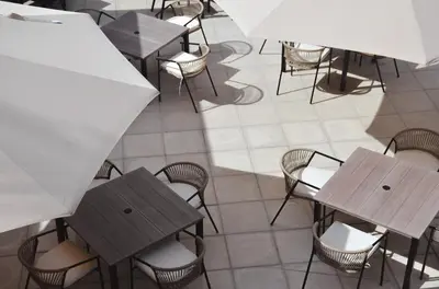 an overhead view of a restaurant with tables and chairs at Astra Beach Club & Resort in Marcelino