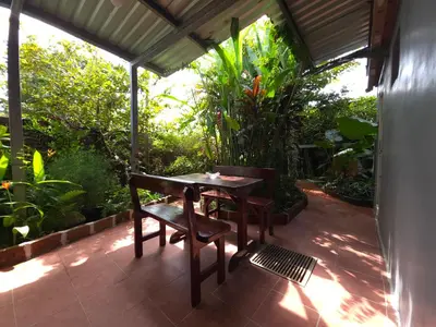 a table and two chairs on a patio at Beautiful and comfortable house in Sonsonate
