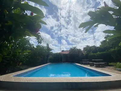 a swimming pool in a yard with a sky at Termales El Paraíso in Turín