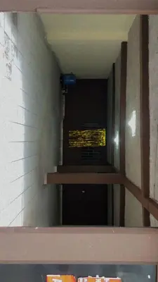 a stairwell in a building with a sign on the wall at Noche de Luna in San Salvador