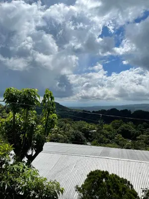 a view of a metal roof with trees and clouds at Bed Room San Francisco Chinameca in San Francisco Chinameca