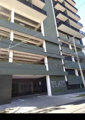 a building with a parking garage in front of it at Beautiful apartment near Salvador del Mundo in San Salvador
