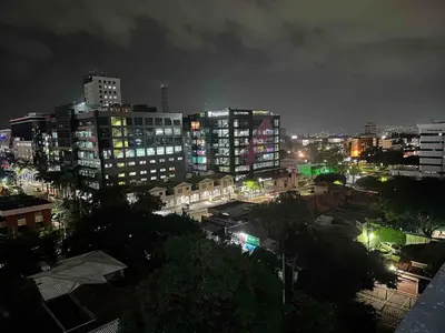 a city lit up at night with tall buildings at Beautiful apartment near Salvador del Mundo in San Salvador