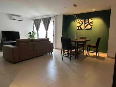 a living room with a couch and a table at Beautiful apartment near Salvador del Mundo in San Salvador