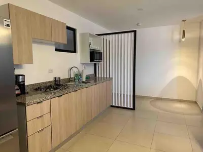 a kitchen with a sink and a counter top at Beautiful apartment near Salvador del Mundo in San Salvador