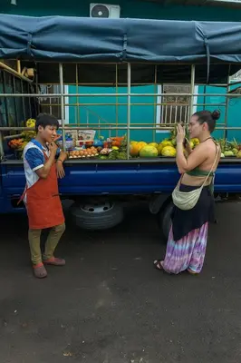 two people standing in front of a food truck at The Duck Dive El Tunco in Tamanique