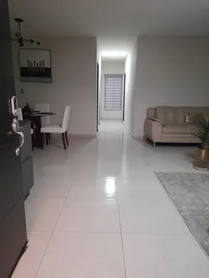 a living room with a couch and a table at Moderno, acogedor y privado, en San Salvador in San Salvador