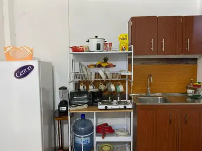 a small kitchen with a sink and a counter top at Aguiñada's house en el Rosario La Paz in El Rosario