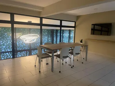 a dining room with a wooden table and chairs at Cozy apartment with panoramic view in San Salvador
