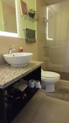 a bathroom with a sink and a toilet at Habitación en casa de Diana in San Salvador