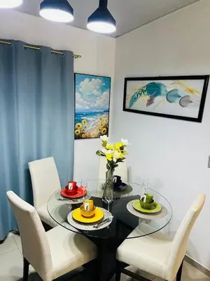 a dining room with a glass table and chairs at Exclusivo y céntrico en San Miguel in San Miguel