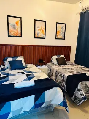 two beds in a room with at Exclusivo y céntrico en San Miguel in San Miguel
