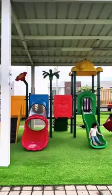 a child sitting on a slide on a playground at Exclusivo y céntrico en San Miguel in San Miguel