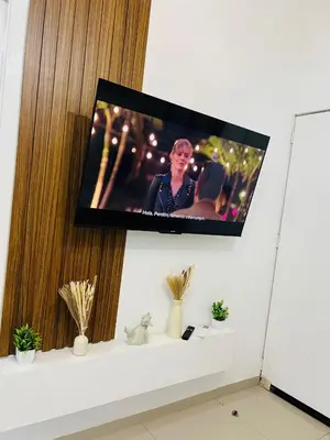 a flat screen tv hanging on a wall at Exclusivo y céntrico en San Miguel in San Miguel