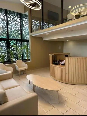 a lobby with a waiting room with a table and chairs at Beautiful City & Volcano Views in San Salvador