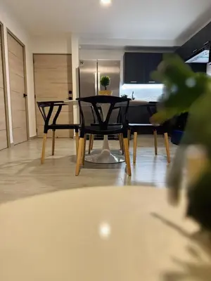 a dining room with a table and chairs at Beautiful City & Volcano Views in San Salvador