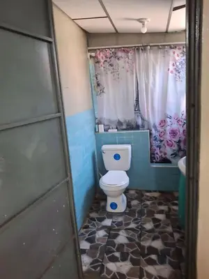 a bathroom with a toilet and a sink at Apartamento in San Salvador