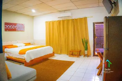 a bedroom with a bed and a yellow curtain at Suite 608 Ciudad Jardín San Miguel in San Miguel