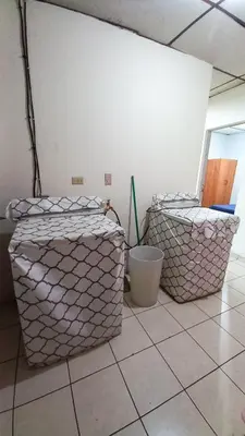 two boxes sitting on the floor in a room at Casa Flor Blanca in San Salvador