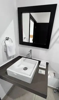 a bathroom with a white sink and a mirror at Room 7 Ciudad Jardin in San Miguel