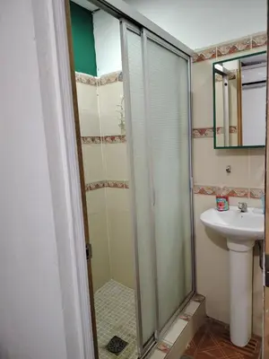 a bathroom with a shower and a sink at Rancho Los Hernandez - Surf City - El Tunco in Tamanique