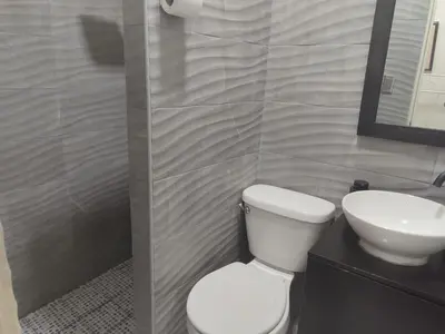 a bathroom with a toilet and a sink at Estancia WLC