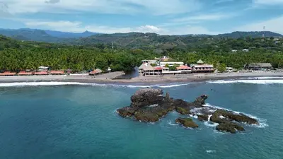 an aerial view of a beach with a resort at Surfside El Tunco in Tamanique